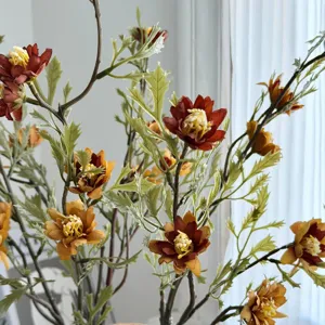Detailed view of realistic autumn colored artificial wild daisy flowers for home decor
