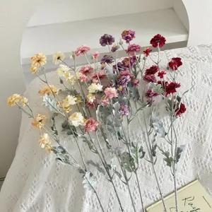 Detail of high-quality flocked artificial camellia flowers with multiple colorful heads