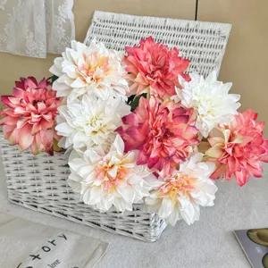Detail of vintage burnt edge artificial dahlias arranged in a rustic wicker basket