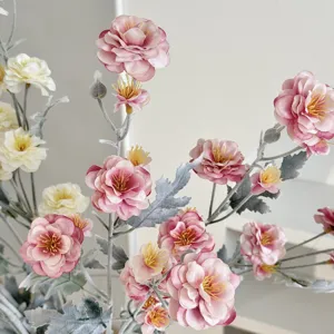 Detailed macro view of artificial flocked pink camellia flower stems for decor