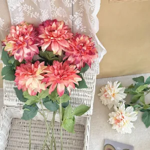 Detailed view of vintage burnt edge artificial dahlias in a rustic white wicker basket