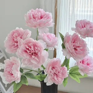 Detailed macro view of delicate pink silk peony flowers with realistic layered petals.