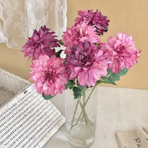 Close-up of vintage pink and purple artificial dahlia flowers with burnt edge detail