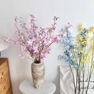 Artificial dancing-lady orchid flowers in a rustic vase, detailed view for home decor
