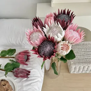Beautiful pink and white artificial protea flowers in vase for home bedroom decor