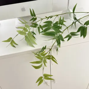 Realistic green artificial bamboo leaf branch for zen indoor home office decor setup