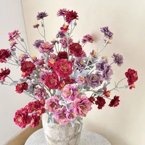 Elegant flocked camellia artificial flowers in a stone vase for living room table decor