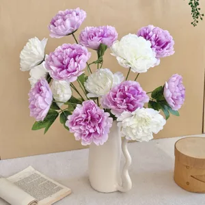 Detailed view of high-quality artificial peonies in a ceramic vase for home decoration.