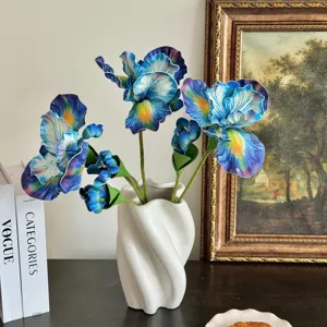 Artistic oil-painting style blue iris flowers in a modern white twisted vase