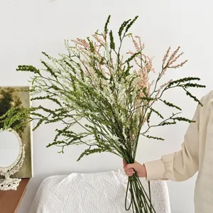 Groot kunstmatig rijstgras boeket voor elegante woondecoratie en fotografie.