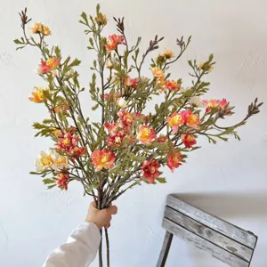 Macro detail of autumn-colored vintage artificial wild chrysanthemum bouquet for decor.