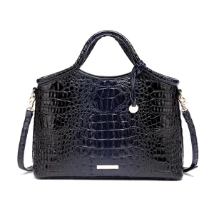 Elegante bolso de mano en cuero grabado de cocodrilo azul marino con detalles dorados