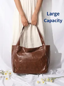 Bolso tote grande retro de cuero encerado marrón para mujer con un práctico bolsillo frontal