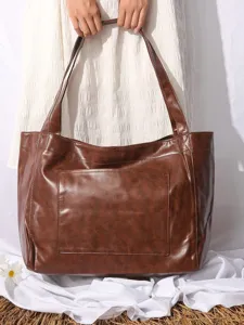 Bolso tote vintage de cuero encerado marrón con gran capacidad y bolsillo frontal
