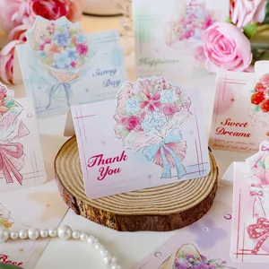 Close-up of floral thank you greeting card with hand-painted flower bouquet illustration