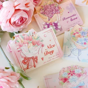 Close-up of floral bouquet greeting cards with 'Nice Day' and 'Romantic love' messages