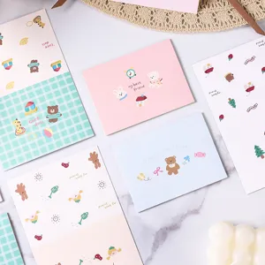 Close-up of pastel cartoon animal greeting cards featuring cute bear and rabbit motifs