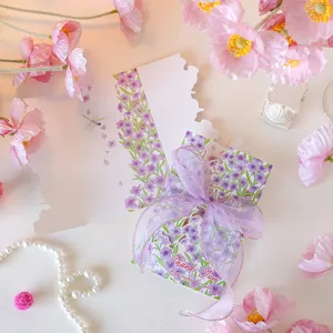 Detailed view of elegant floral thank you card featuring a purple ribbon and dragonfly motif