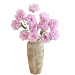 Realistic artificial purple peony bouquet in rustic ceramic vase for home table decor