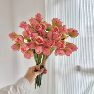 Realistic 24-head artificial pink tulip bouquet held by hand for elegant home decoration