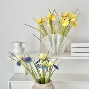 Elegant faux yellow and blue iris artificial flowers in stylish vases for home decor