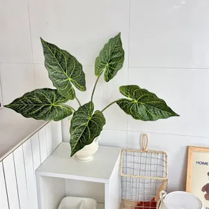 Detailed macro view of 3D printed Caladium artificial leaves displayed in a white vase