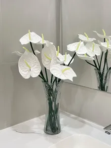 Elegant white EVA artificial Anthurium flowers displayed in a stylish glass vase