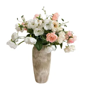 Elegant white and pink artificial peony flower arrangement in a textured ceramic vase