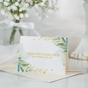 Elegante tarjeta de felicitación floral con texto 'I Wish You Good Luck' en pan de oro