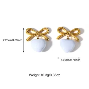 Detailed measurements and weight for gold bow and white heart-shaped drip oil earrings