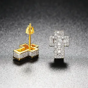 Macro view of iced out cross stud earrings with screw back detail and zircon stones.