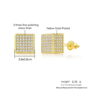 Detail view of square hip-hop stud earrings with micro-pave stones and gold finish