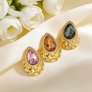 Elegant water drop shaped zircon brooches in pink amber and grey with textured gold finish
