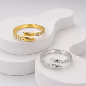 Detailed view of gold and silver plated stainless steel open rings with inlaid crystal stones