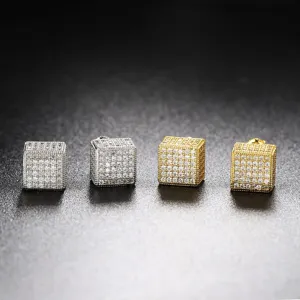 Close-up of iced out square stud earrings in silver and gold micro-pave CZ stones