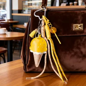 Grazioso ciondolo borsa gelato in pelle PU con corde intrecciate colorate e portachiavi.