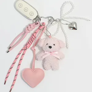 Pink plush bear keychain with pearl bow, leather heart pendant and braided strap cute bag charm