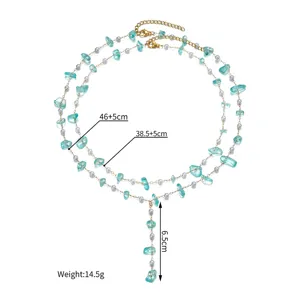 Detail view of layered light blue stone and pearl necklace with size measurements.