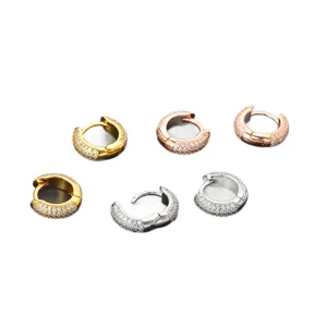 Stylish paved cubic zirconia huggie hoop earrings in gold, silver and rose gold.