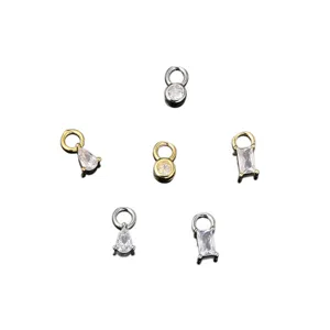 Pequeños dijes de joyería con circonitas en formas redondas, de gota y rectangulares