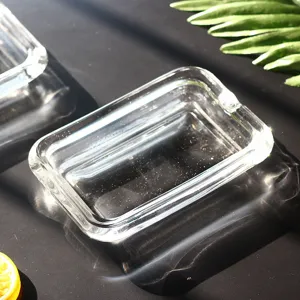 Detail view of a clear glass soap dish with smooth edges and glossy finish