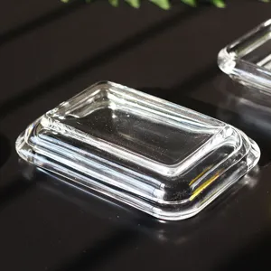 Macro view showing the transparent texture of a rectangular glass soap dish for bathrooms