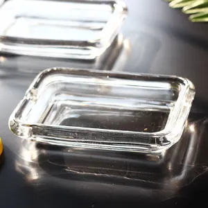 Close-up of a clear glass soap dish showing transparent texture and glossy finish