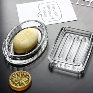 Elegant clear glass soap dish set featuring oval and rectangular designs for bathroom
