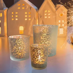 Handmade speckled glass candle holder set, warm glowing votive jar for romantic home decor.