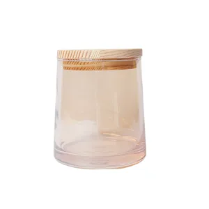 Glass jar with wooden lid for DIY scented candle and home storage, clear cup design.