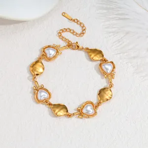Sweet French style gold plated stainless steel bracelet with faux heart pearls detail