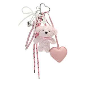 Cute pink plush bear keychain with pearl bow and heart pendant for women's bags