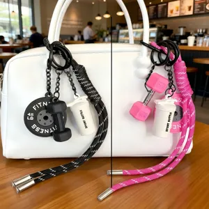 Fitness bag charm keychain with dumbbell and barbell plate pendants, stylish women accessory.