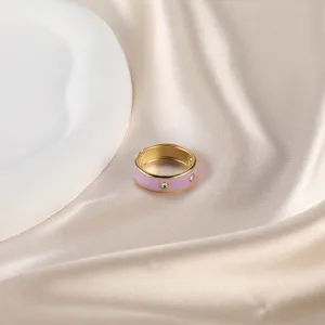 Elegant pink enamel open ring in gold finish with sparkling crystal stone accents